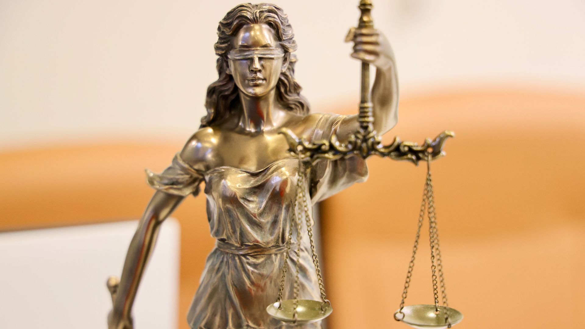Detailed image of Lady Justice statue, symbolizing fairness and impartiality.