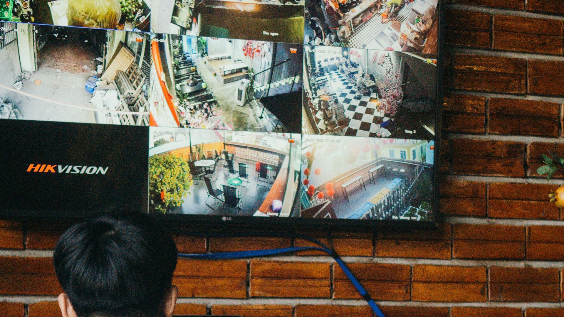 a couple of people sitting at a table in front of a tv