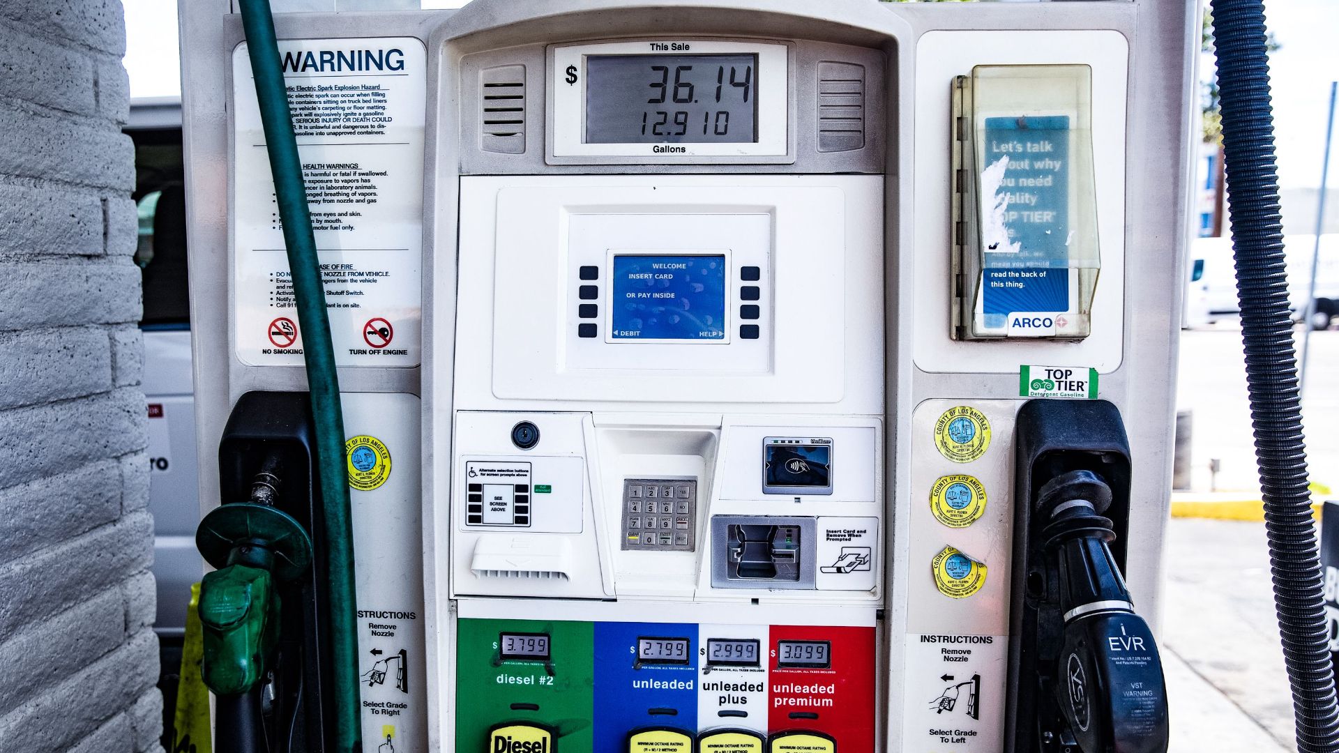 Close-up of a fuel pump showing gasoline and diesel options at a gas station in Los Angeles.