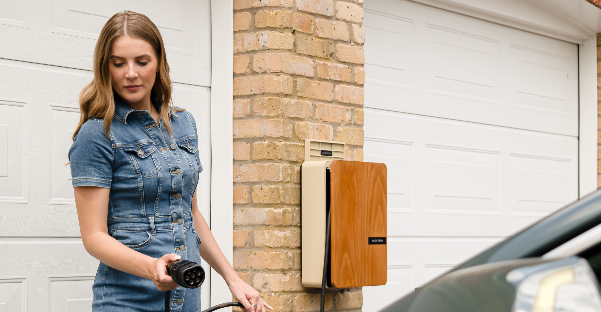 young-woman-using-an-andersen-domestic-ev-charge-point-to-charge-a-fully-electric-kia-niro-ev-at-home