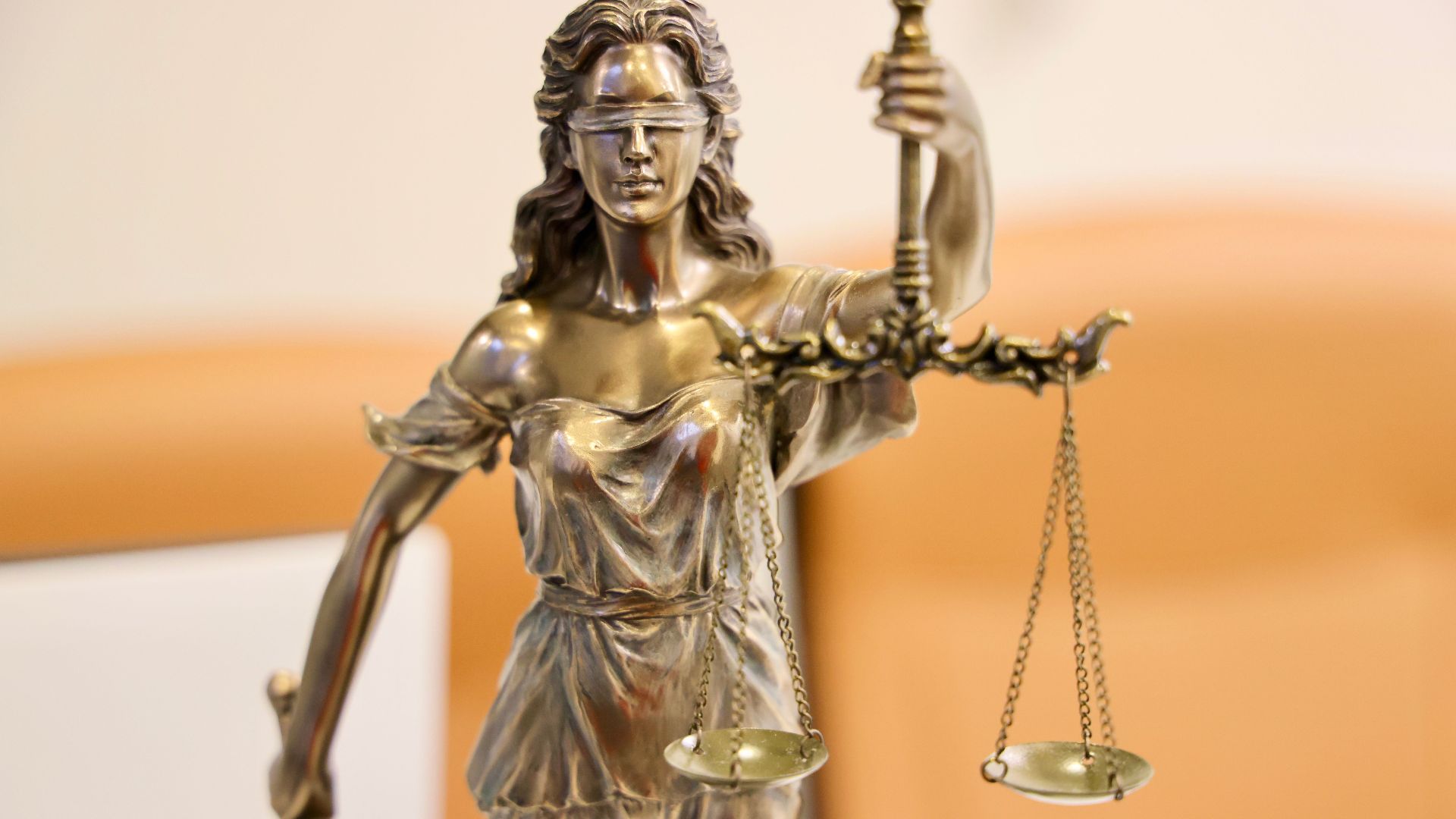 Detailed image of Lady Justice statue, symbolizing fairness and impartiality.