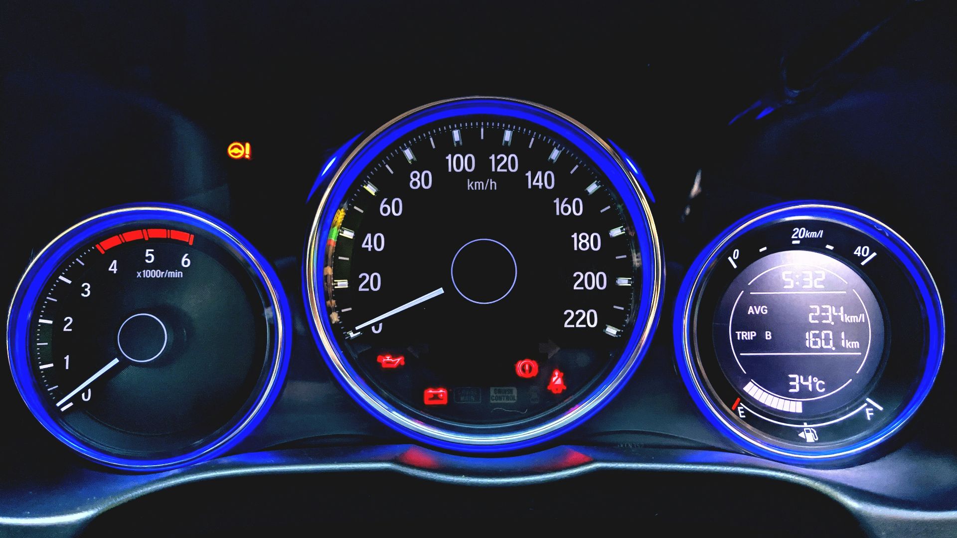 black and blue car speedometer