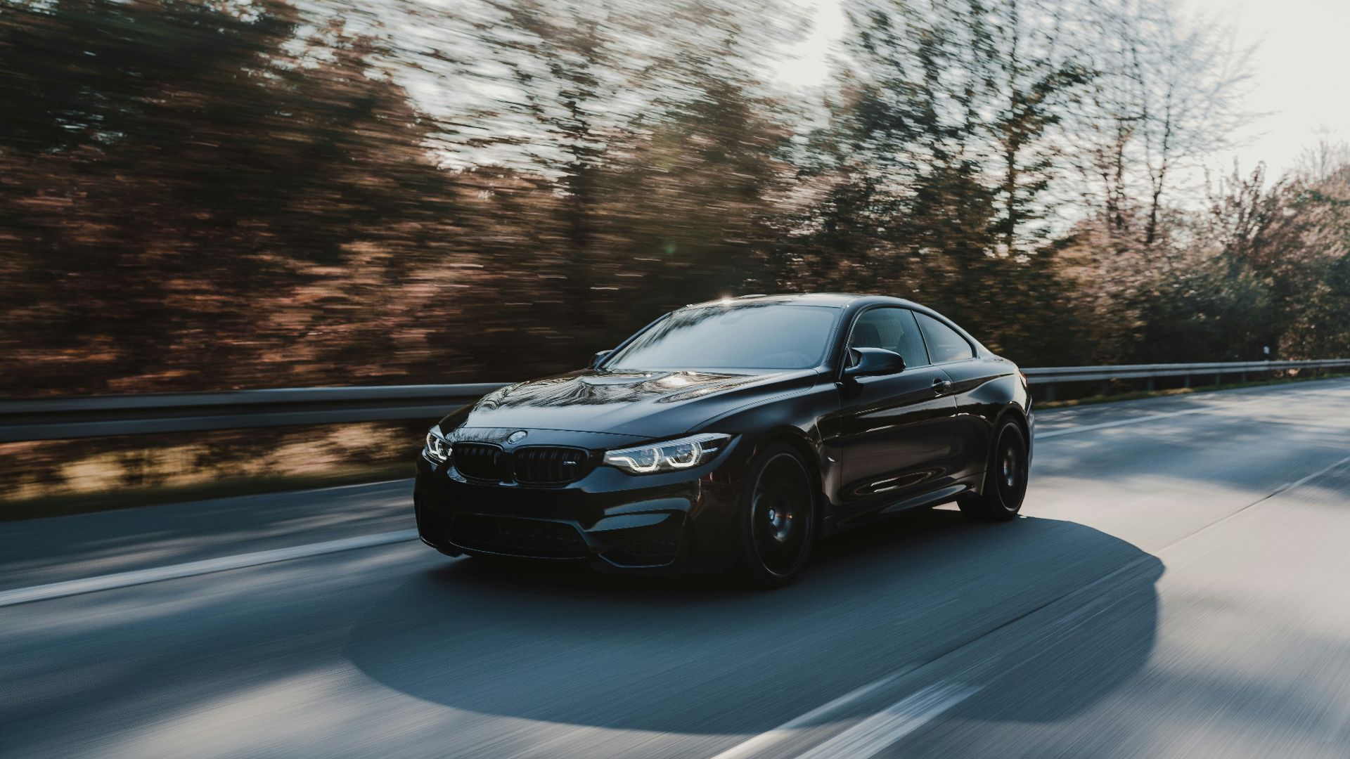 black coupe on road