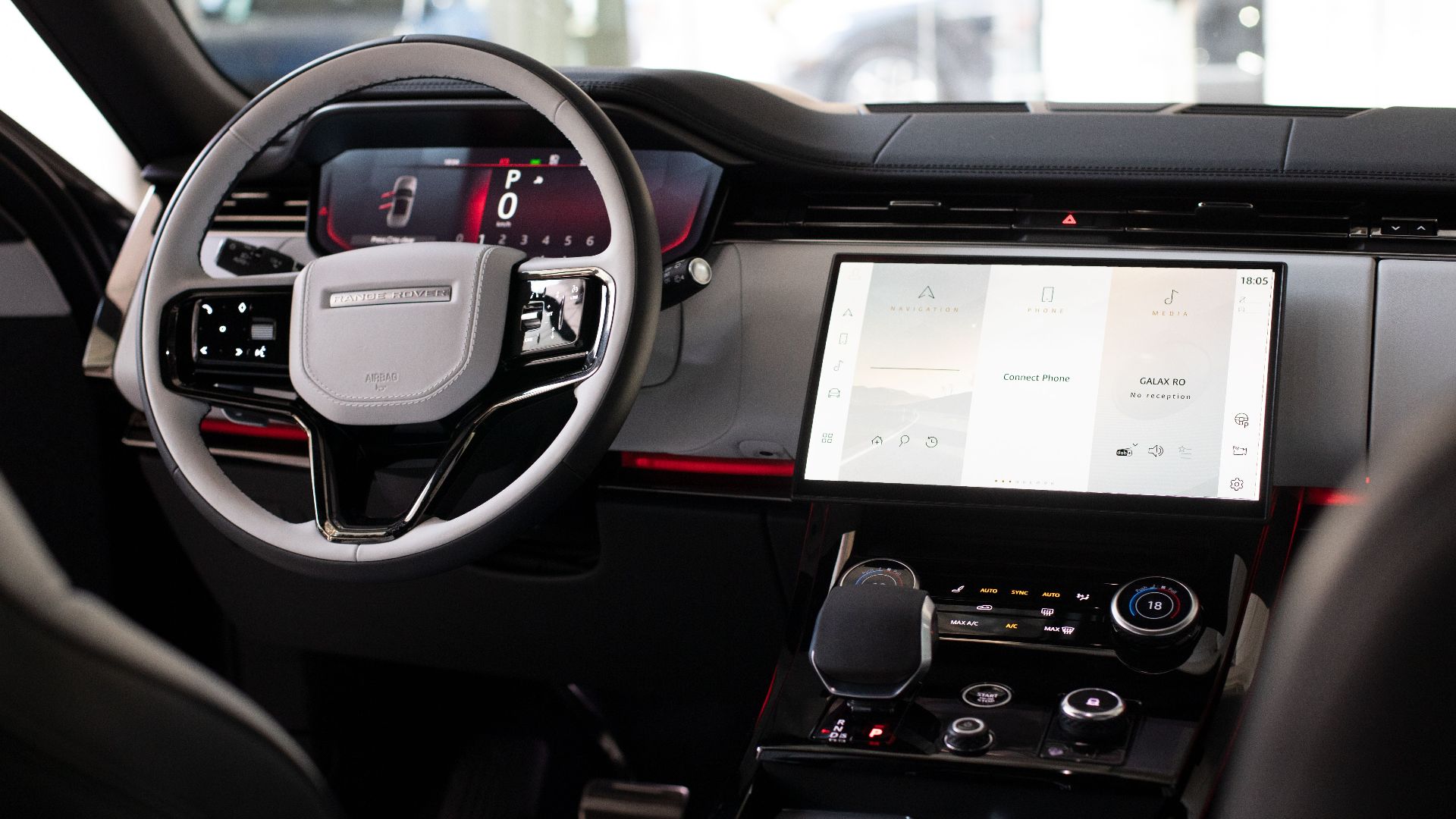 High-end car interior featuring modern digital dashboard and steering wheel.
