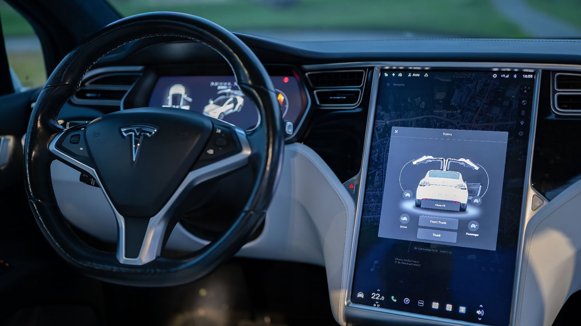 Interior shot of a modern electric car showcasing a sleek design and advanced touchscreen technology.