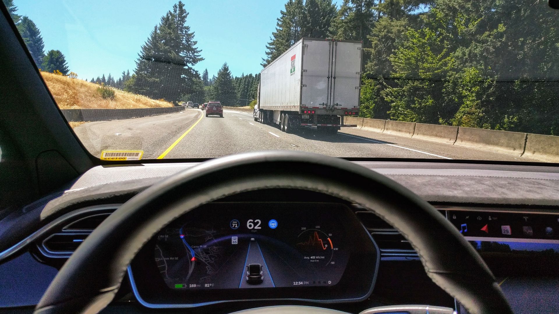 Driving in traffic with Tesla's autopilot controlling distance from the lead car and centering the vehicle in the lane.
Vehicle is a 2017 Model X 75D with dark interior.
