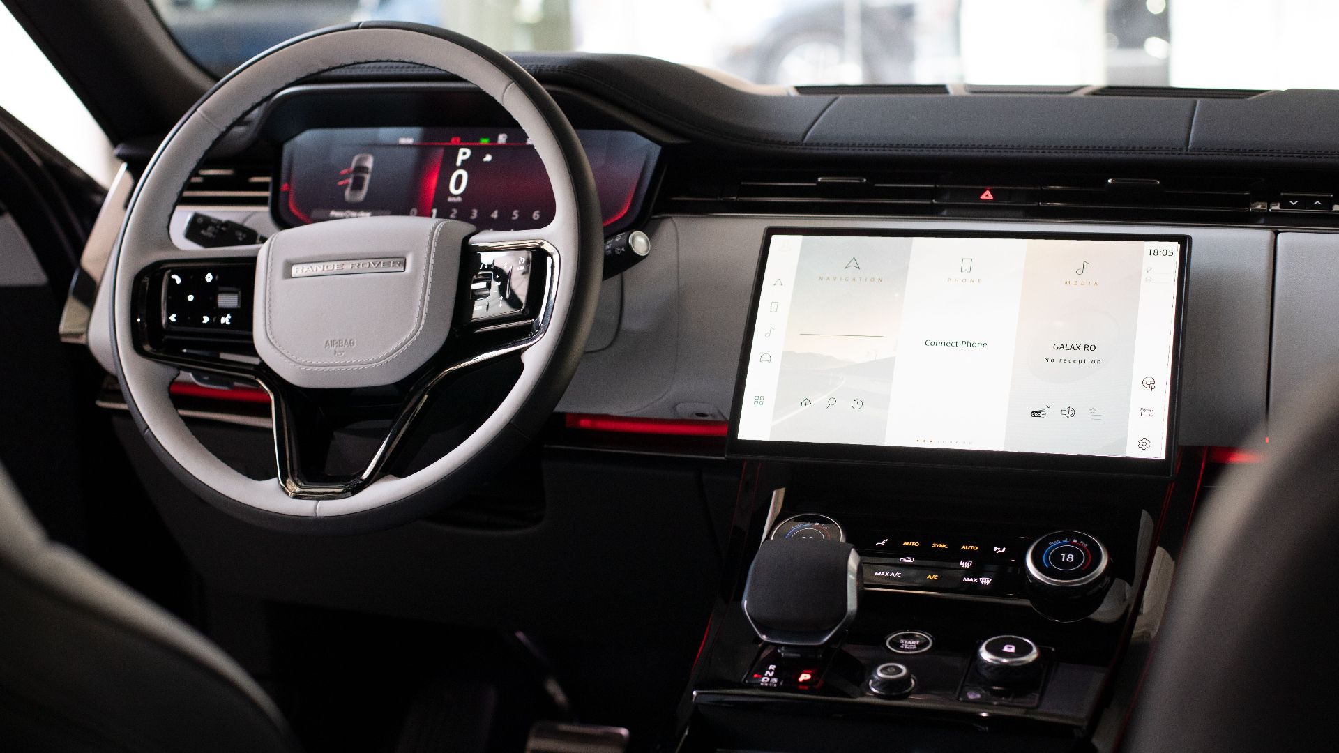 High-end car interior featuring modern digital dashboard and steering wheel.