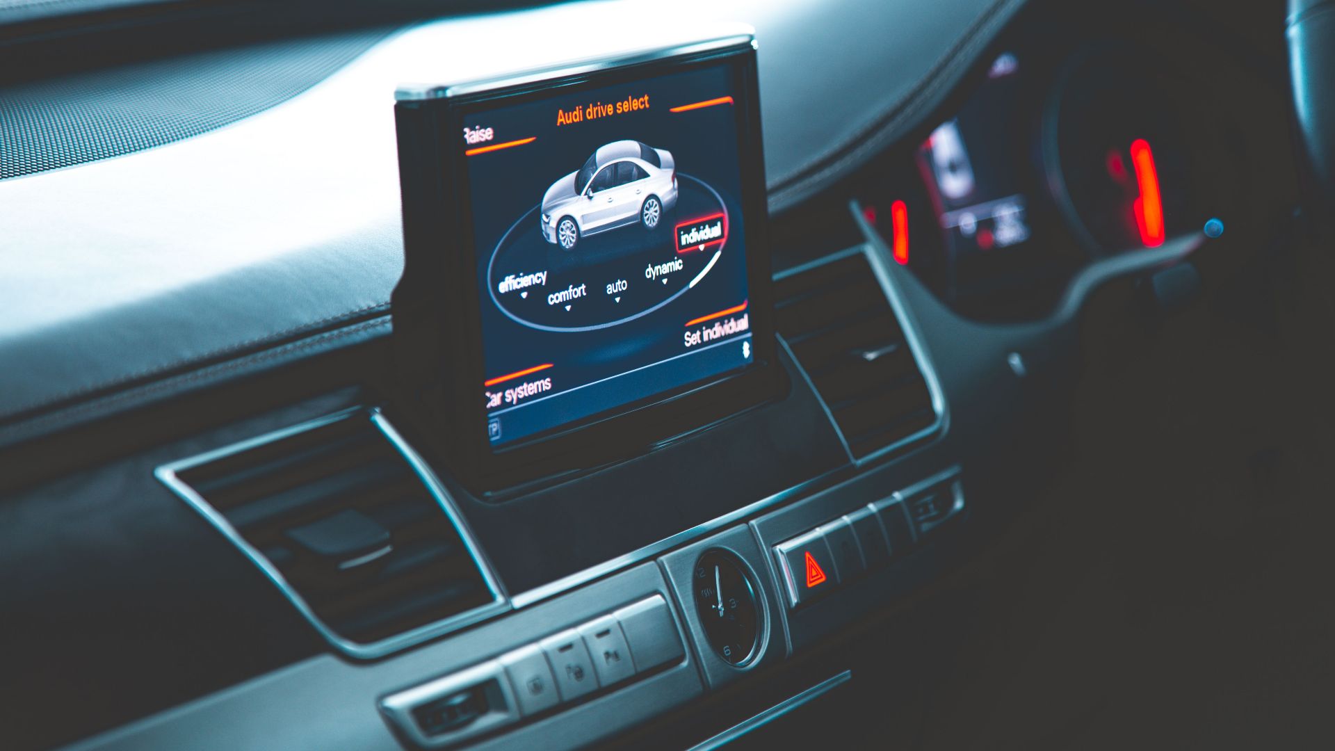 Close-up of a sleek Audi A8 interior highlighting the digital dashboard and multimedia display.