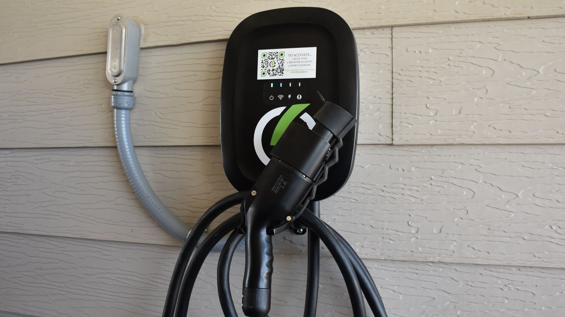 A Level 2 EV charger is seen mounted on the side of a Cavalry Family Housing residence March 19, 2024. TRO Energy Solutions will install, test and maintain the charger for housing residents who sign up for the service. (U.S. Army photo by Janecze Wright, 