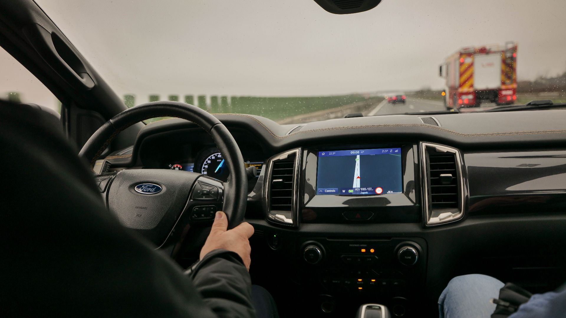 Interior view of driving a Ford with navigation system on a highway near Zagreb, Croatia.