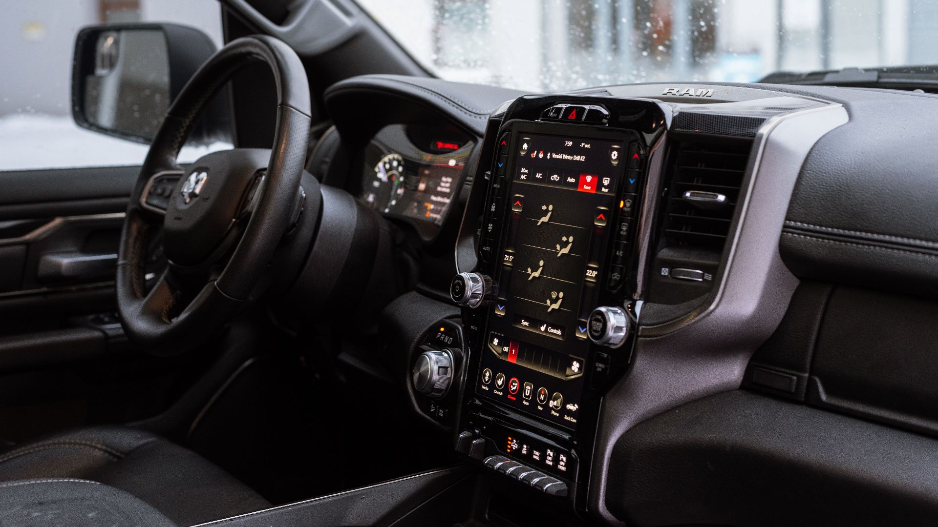 Interior view of a modern vehicle featuring a digital touchscreen dashboard and steering wheel.