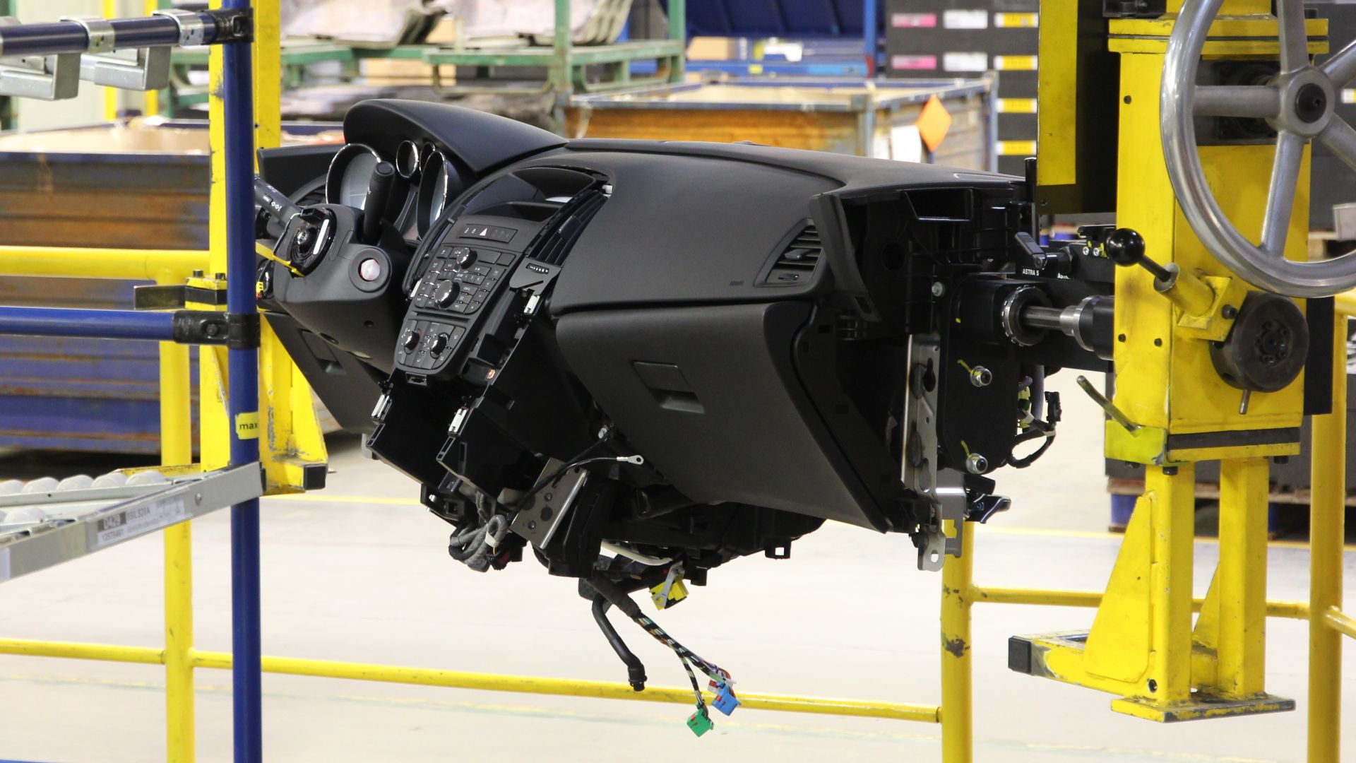 Car dashboard at a factory assembly line. Opel Astra J manufactured in General Motors Manufacturing Poland plant in Gliwice.