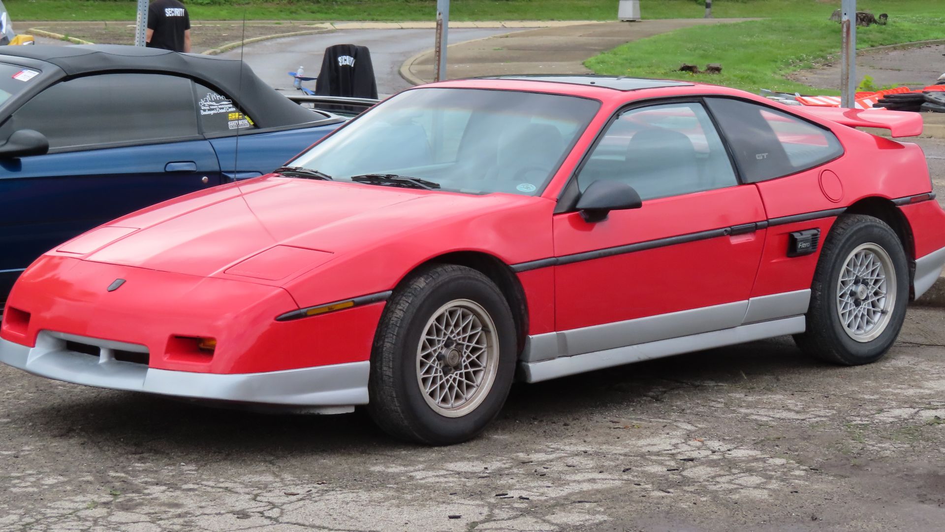 1987 Pontiac Fiero GT photographed at a car show in New Castle, Pennsylvania. Finished in Bright Red.