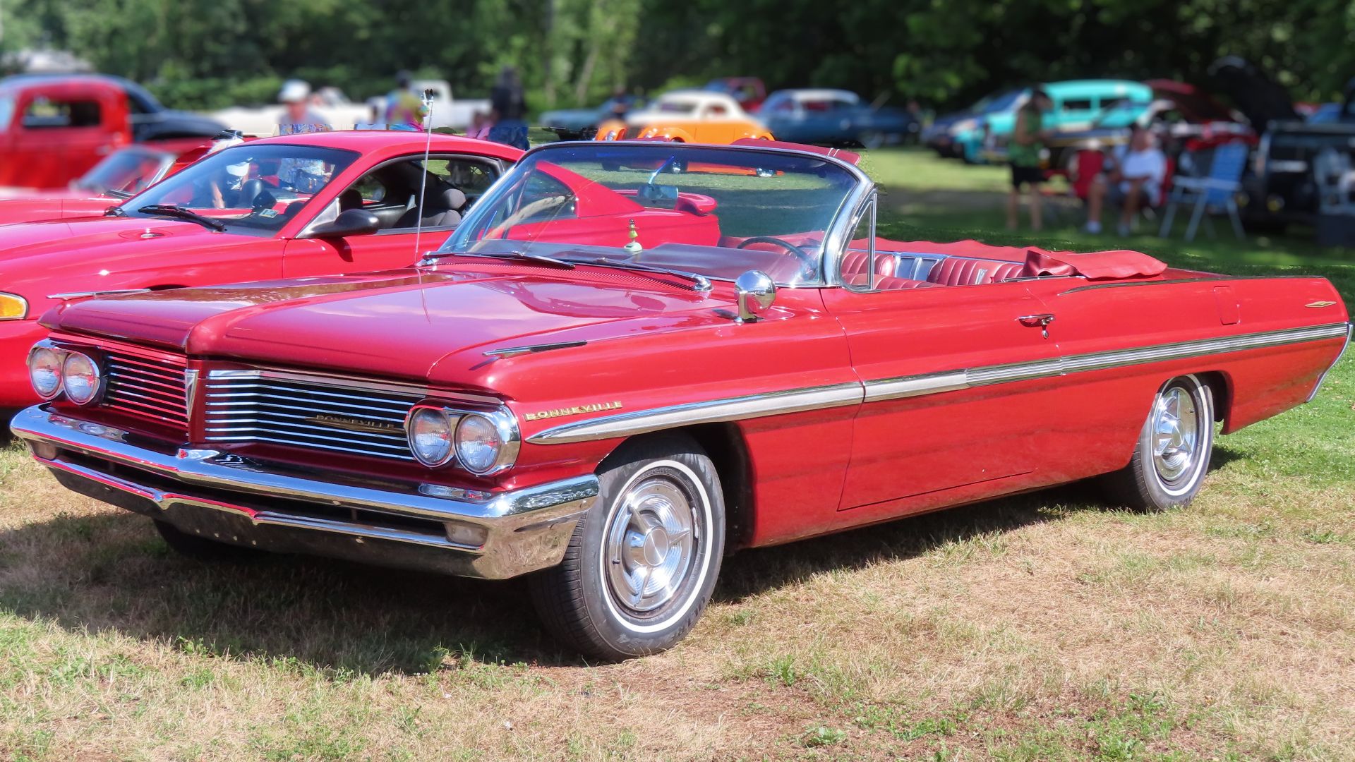 1962 Pontiac Bonneville Convertible Coupe photographed at the June 24th, 2024 Cruisin' the River Lowellville car show in Lowellville, Ohio. Finished in Belmar Red Poly.