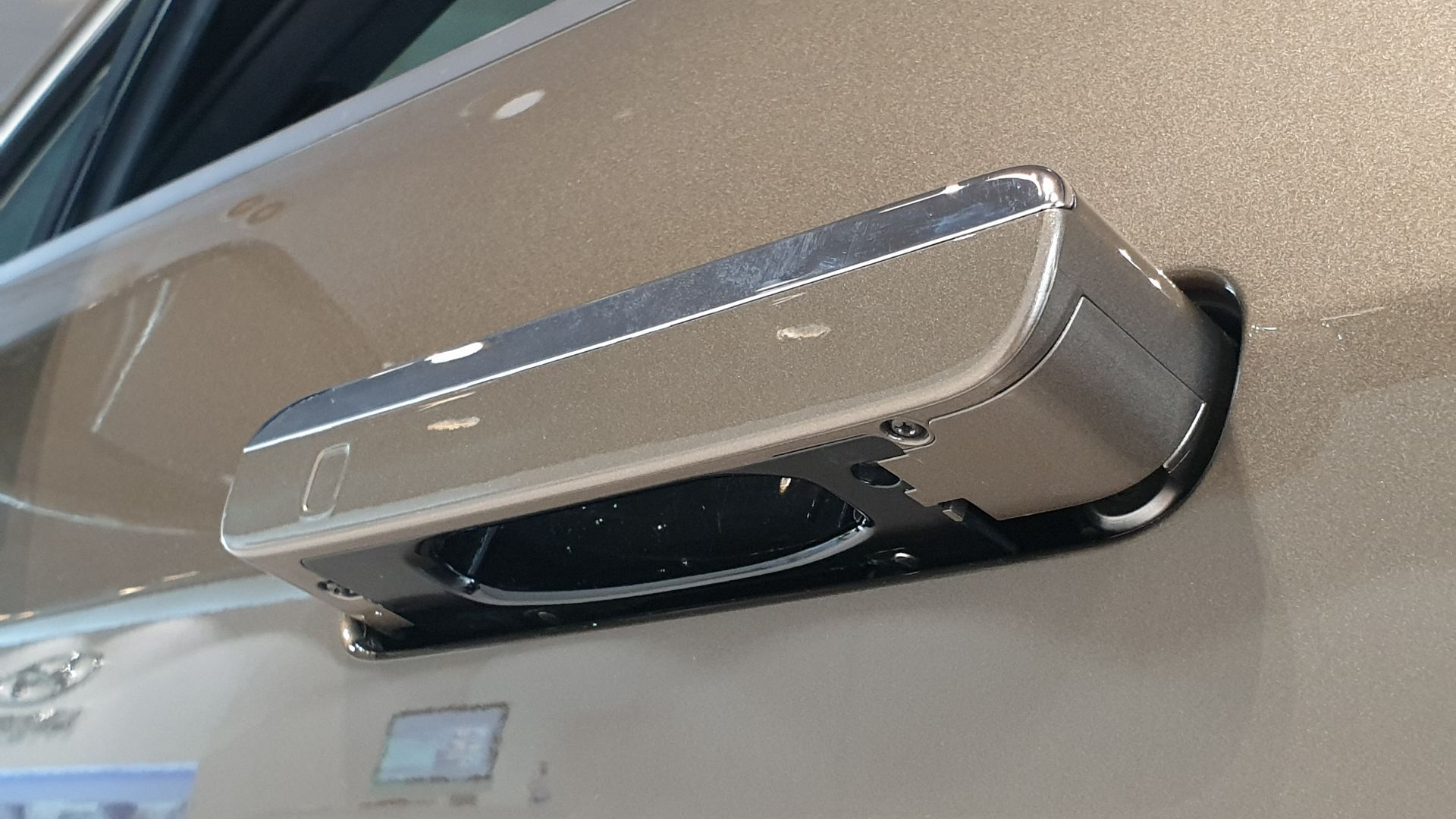 Valencia Gold Genesis G90 RS4 3.5T AWD sedan. Underside of Driver's Auto Flush Door Handle.