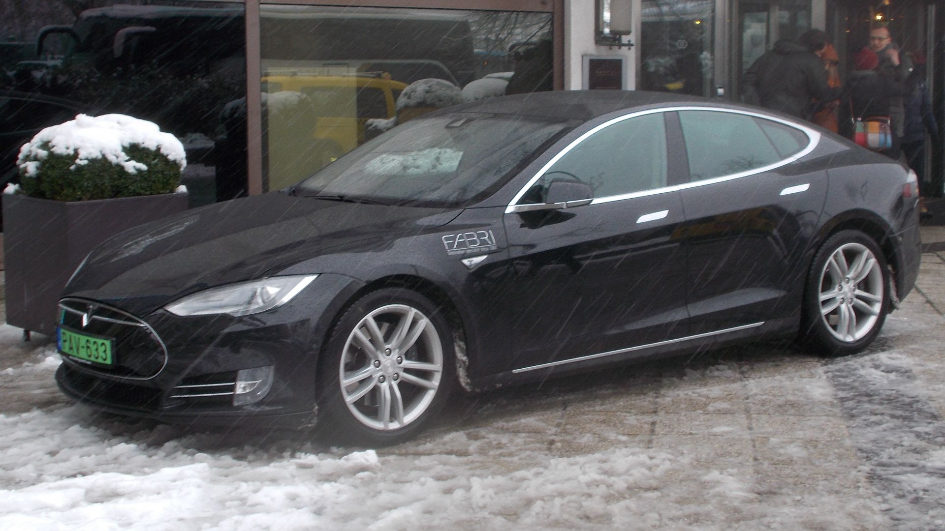 : Tesla Fabri Tours Budapest rental automobile at the Sofitel Budapest Chain Bridge entry. -Széchenyi Square, Lipótváros neighborhood, District V of Budapest