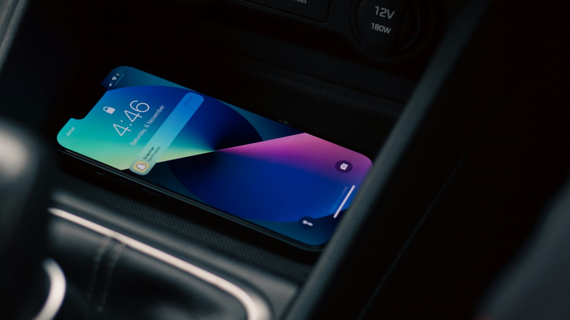 a cell phone in the center console of a car