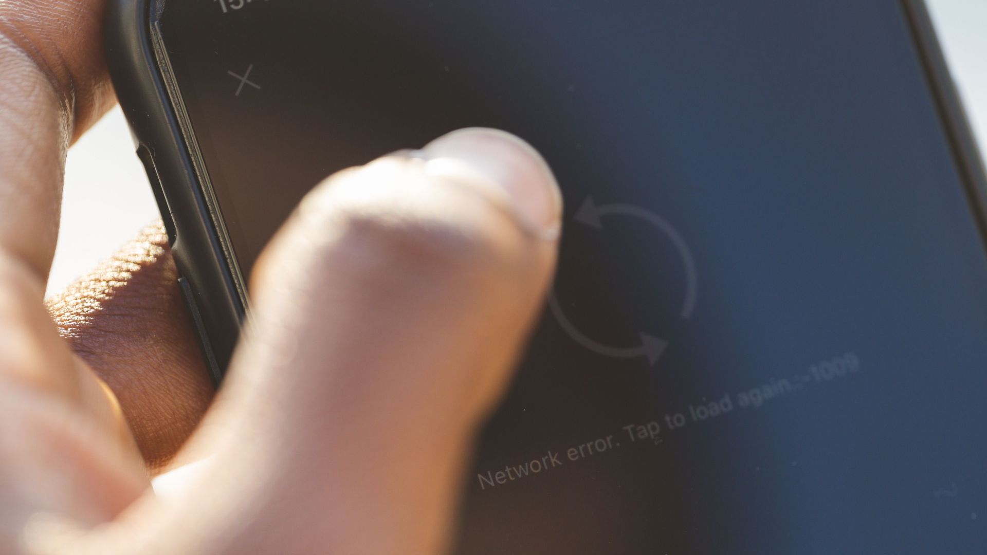 A person uses a smartphone, highlighting touch interaction and screen focus.