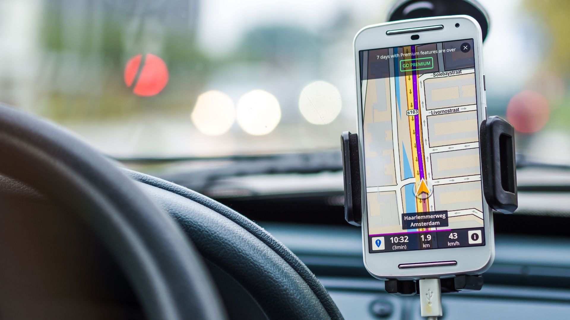 Smartphone mounted in car using GPS for navigation and directions.