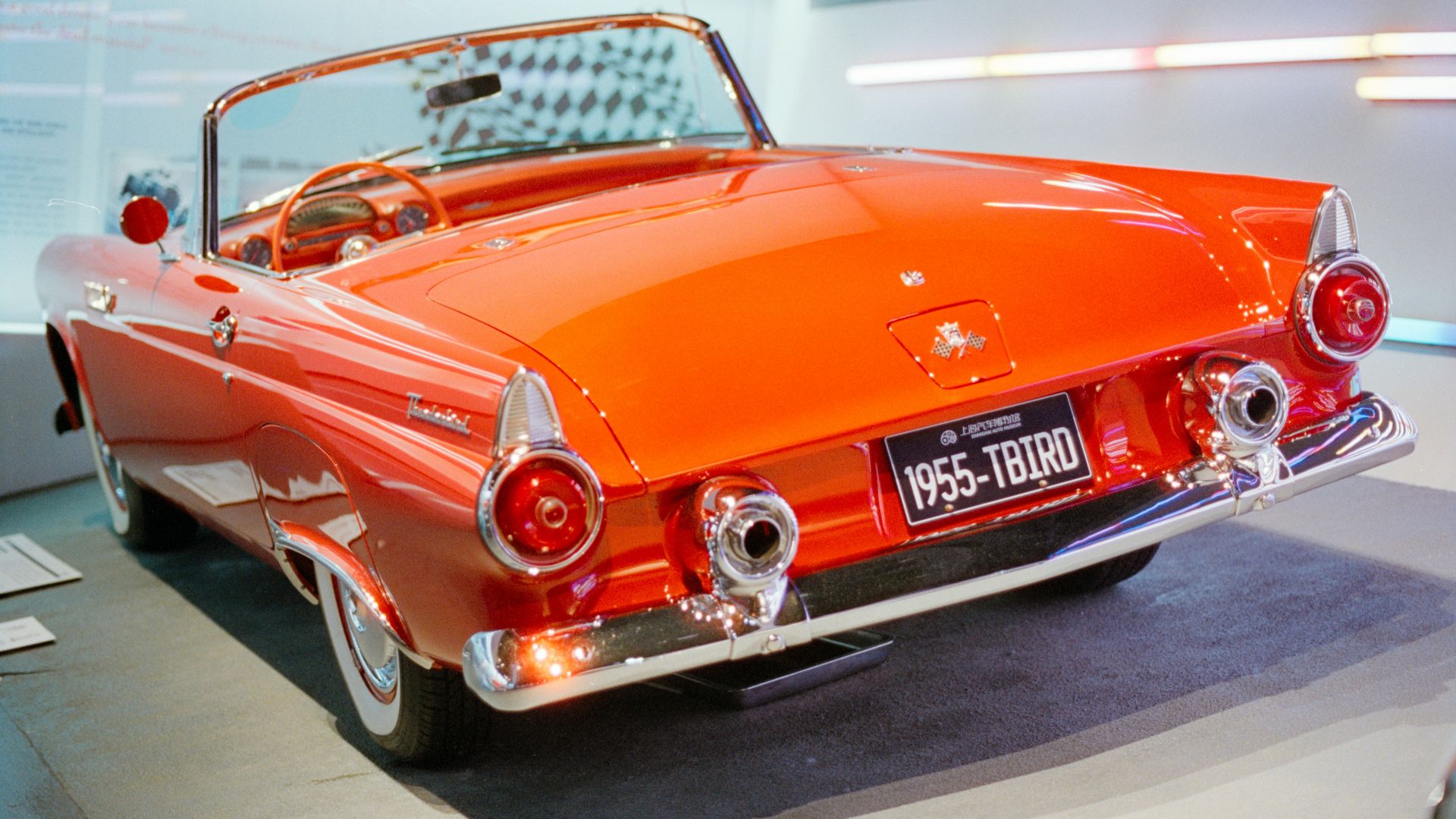 Rear view of a vintage orange convertible car