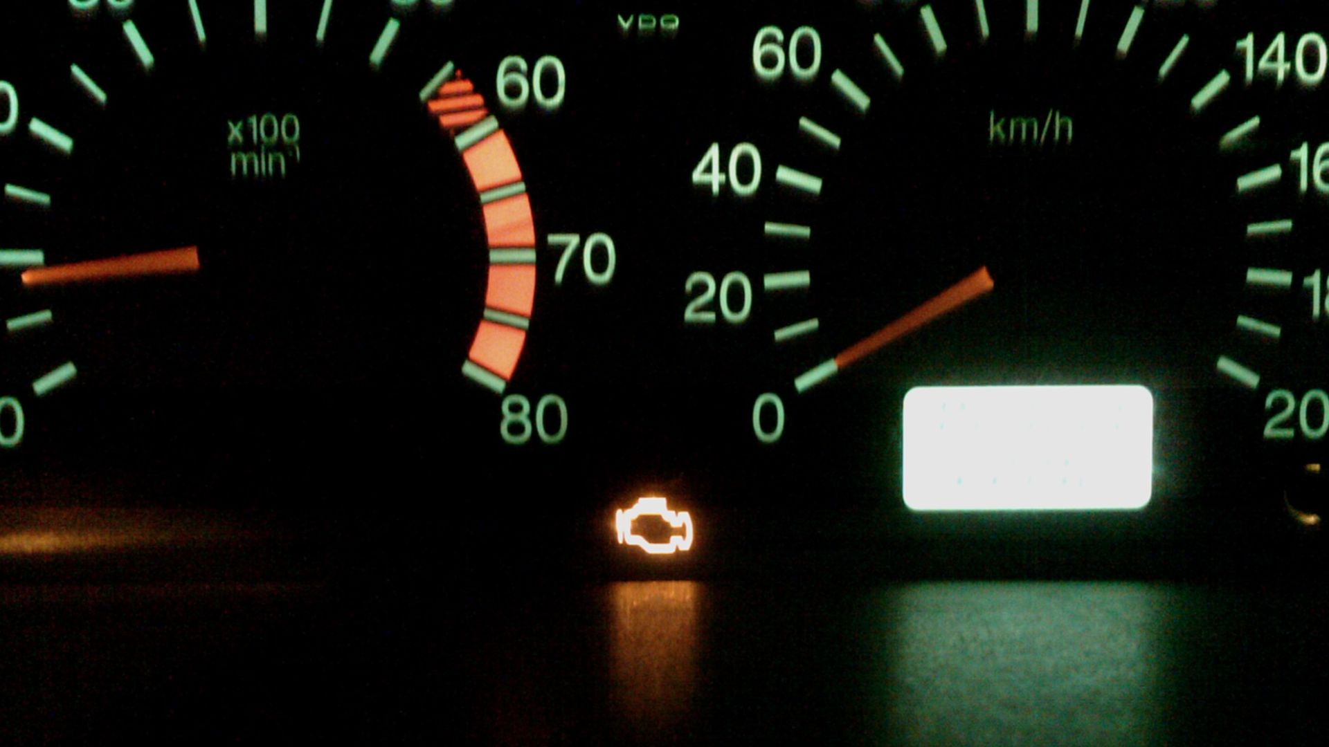 Check Engine lamp on a running engine indicating engine control system malfunction.