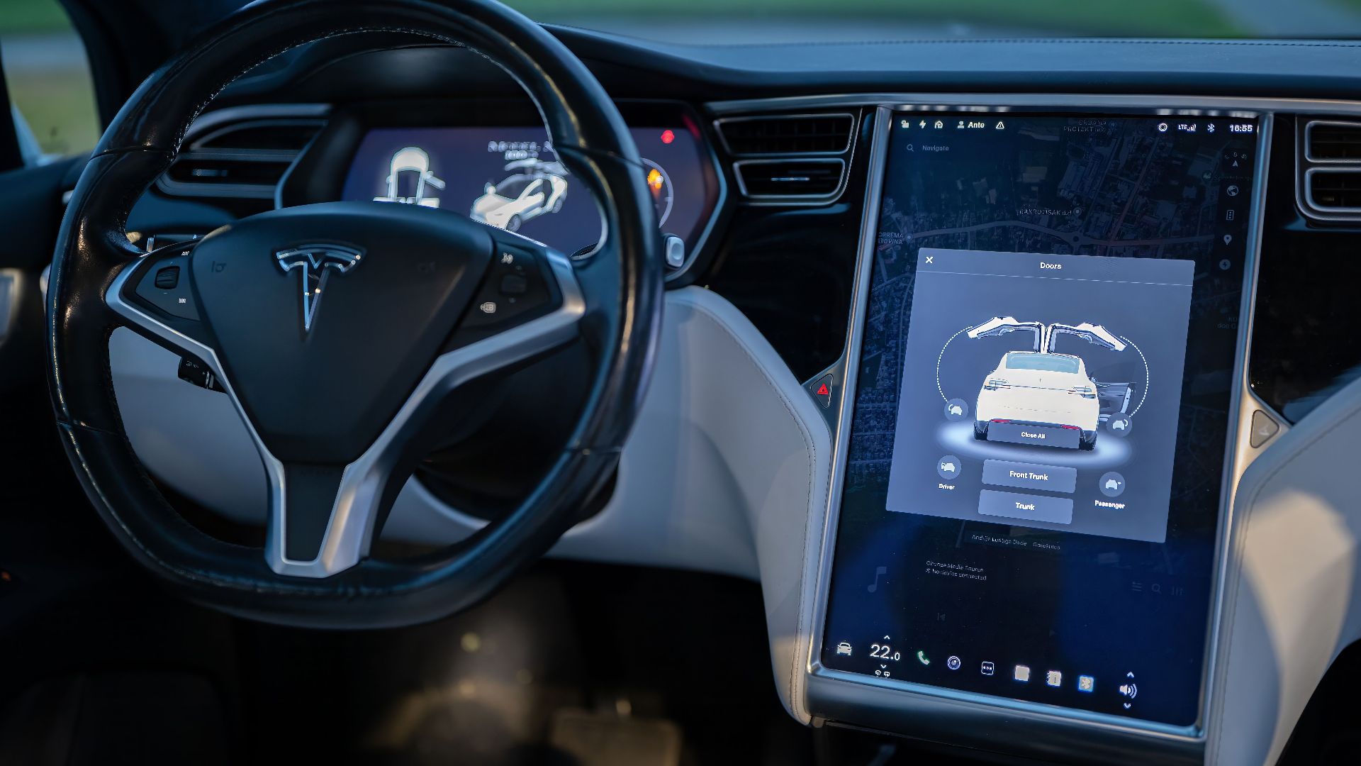 Interior shot of a modern electric car showcasing a sleek design and advanced touchscreen technology.