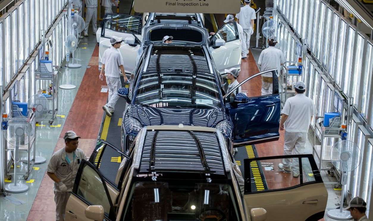 An electric car production assembly line is seen at the GAC Aion Intelligent Ecological Factory in Guangzhou, Guangdong, China, on Friday, September 26, 2025.