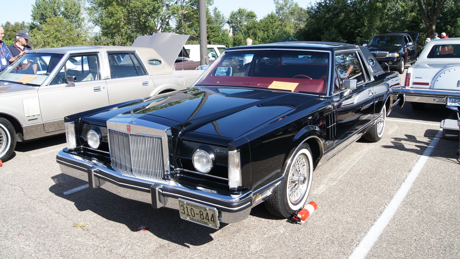 A front view of a 1982 Continental Mark VI Signature Series two-door sedan.  

This sedan is equipped with the optional auxiliary headlamps (shown in the deployed position).