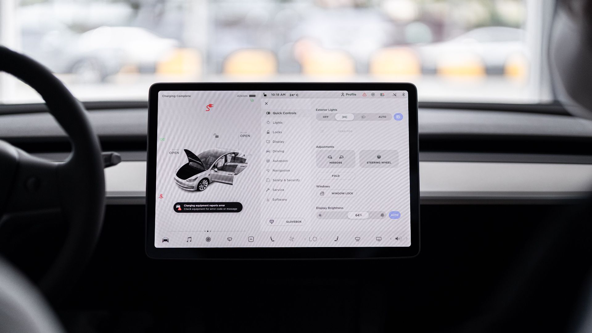 View of a modern car's dashboard featuring a digital display panel with control options.