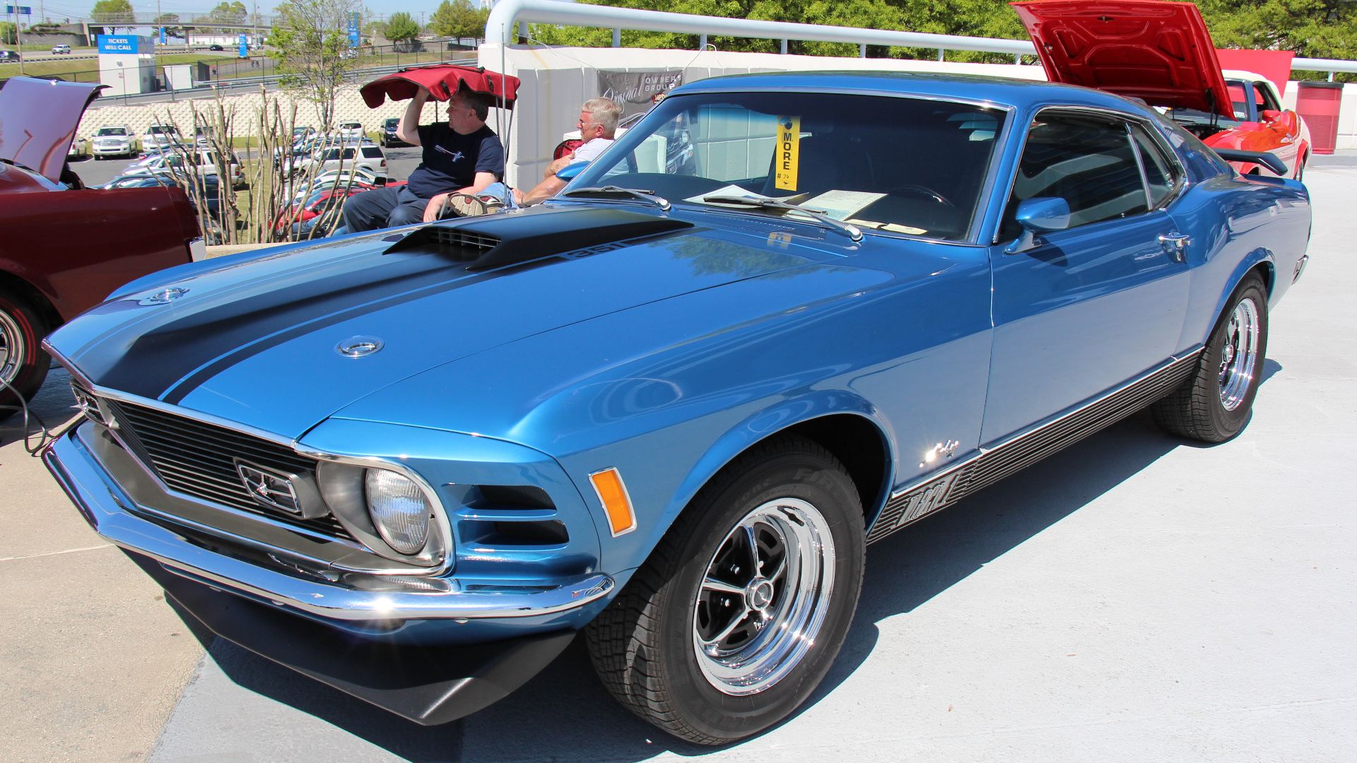 Medium Blue.
The 1970 Mustang was a facelift of the 69, the headlights were moved inside the grille and imitation vents added to the outside where the 69 headlights were, the rear fender scoops were also gone and taillights revised. It was still availabl