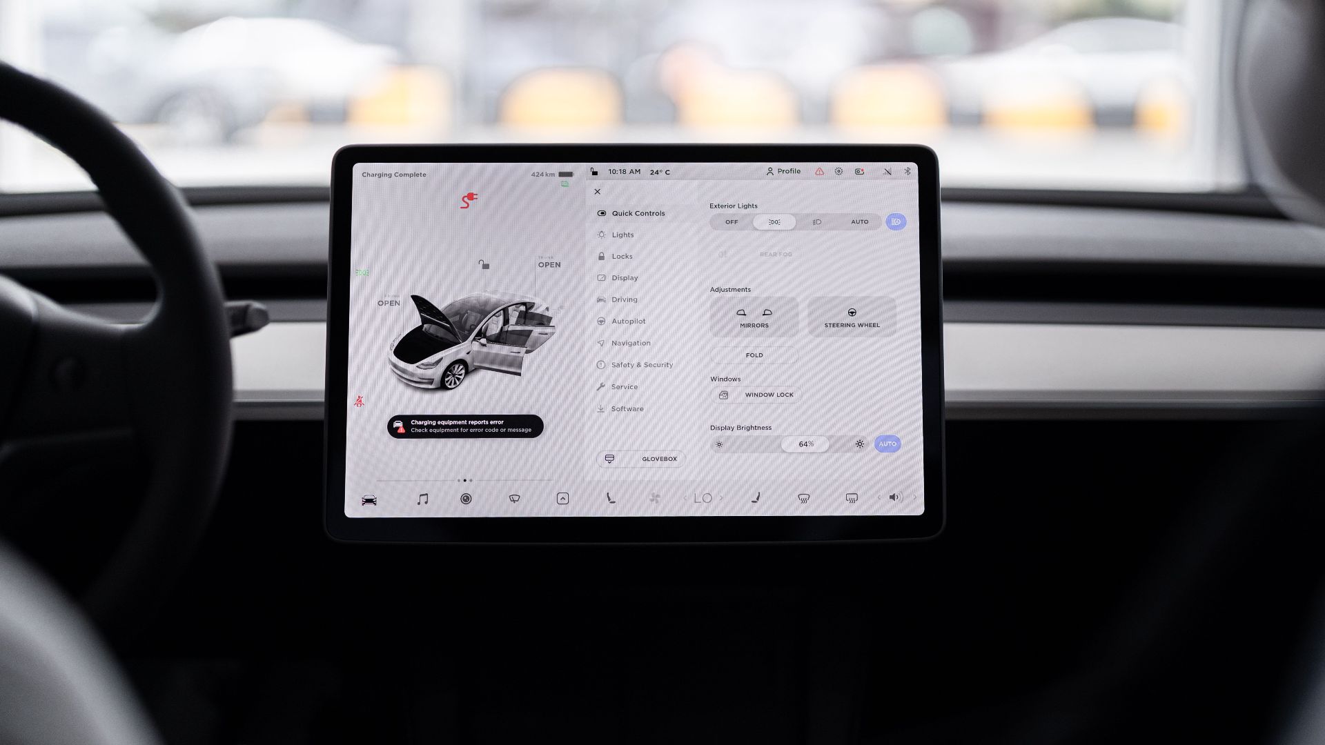 View of a modern car's dashboard featuring a digital display panel with control options.