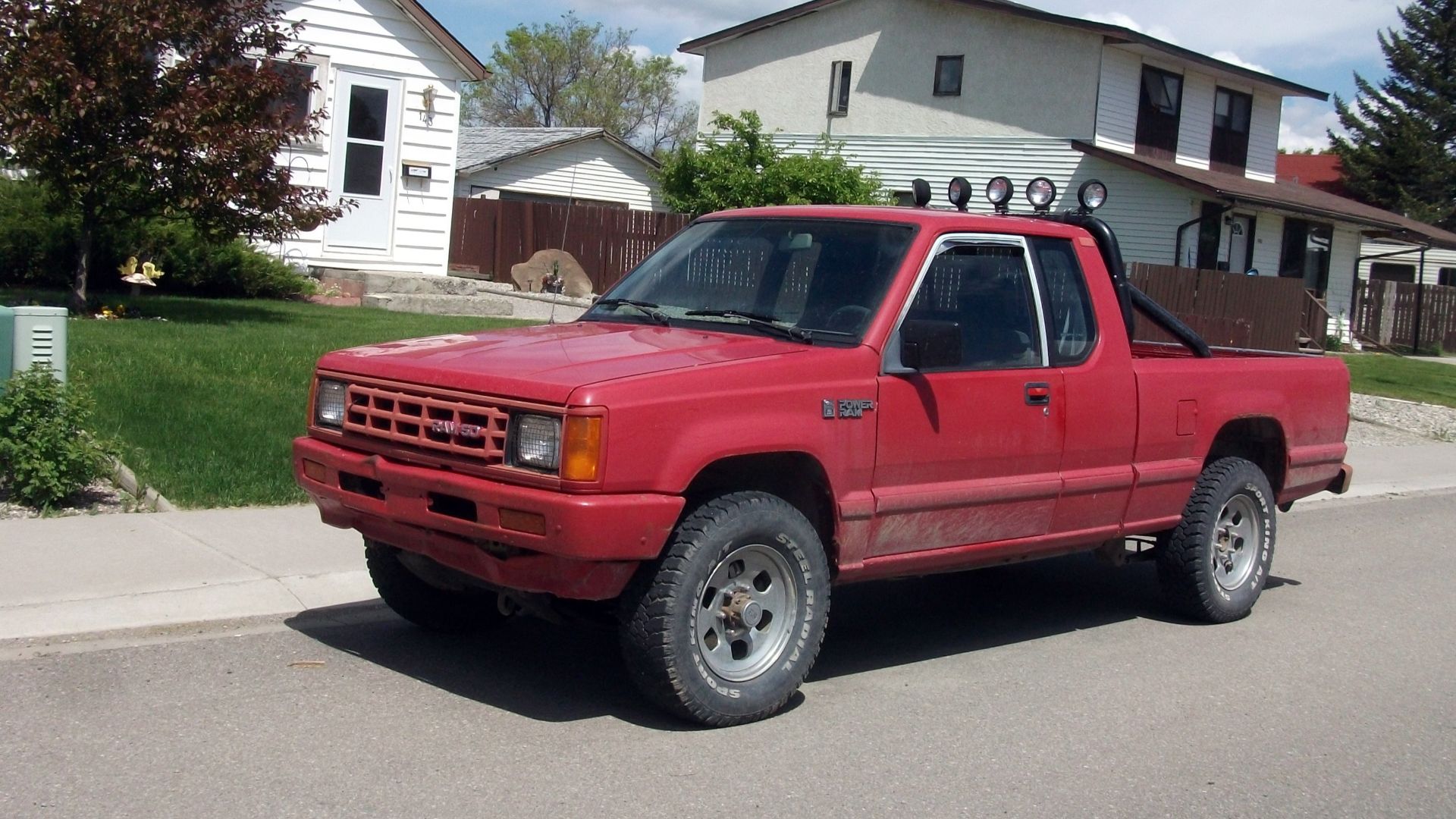 A Dodge Power Ram which was a badge engineered Mitsubishi truck. This one is a super cab and looks to be a 4x4 as well.