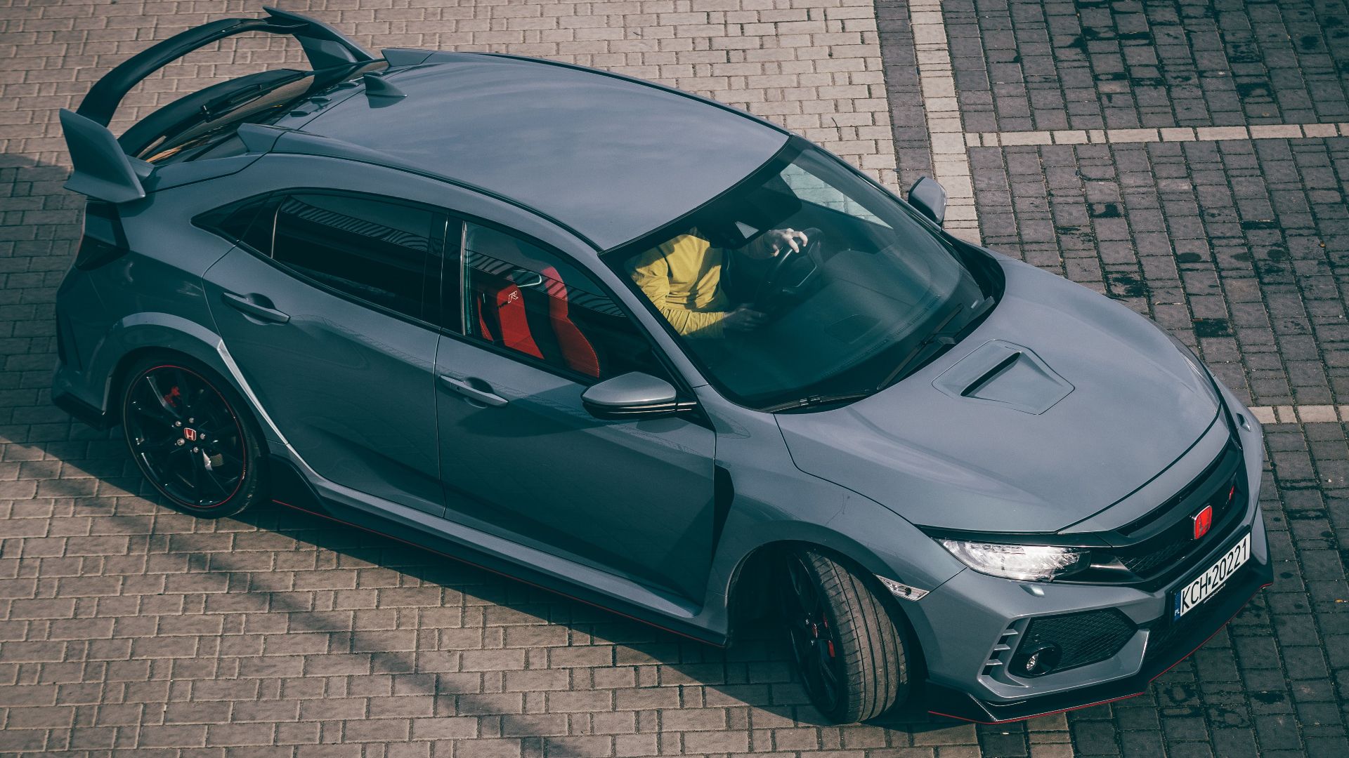 High angle view of a modern Honda Civic Type R in a parking lot.