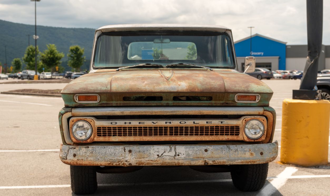 Front view of a vintage rusty Chevrolet truck