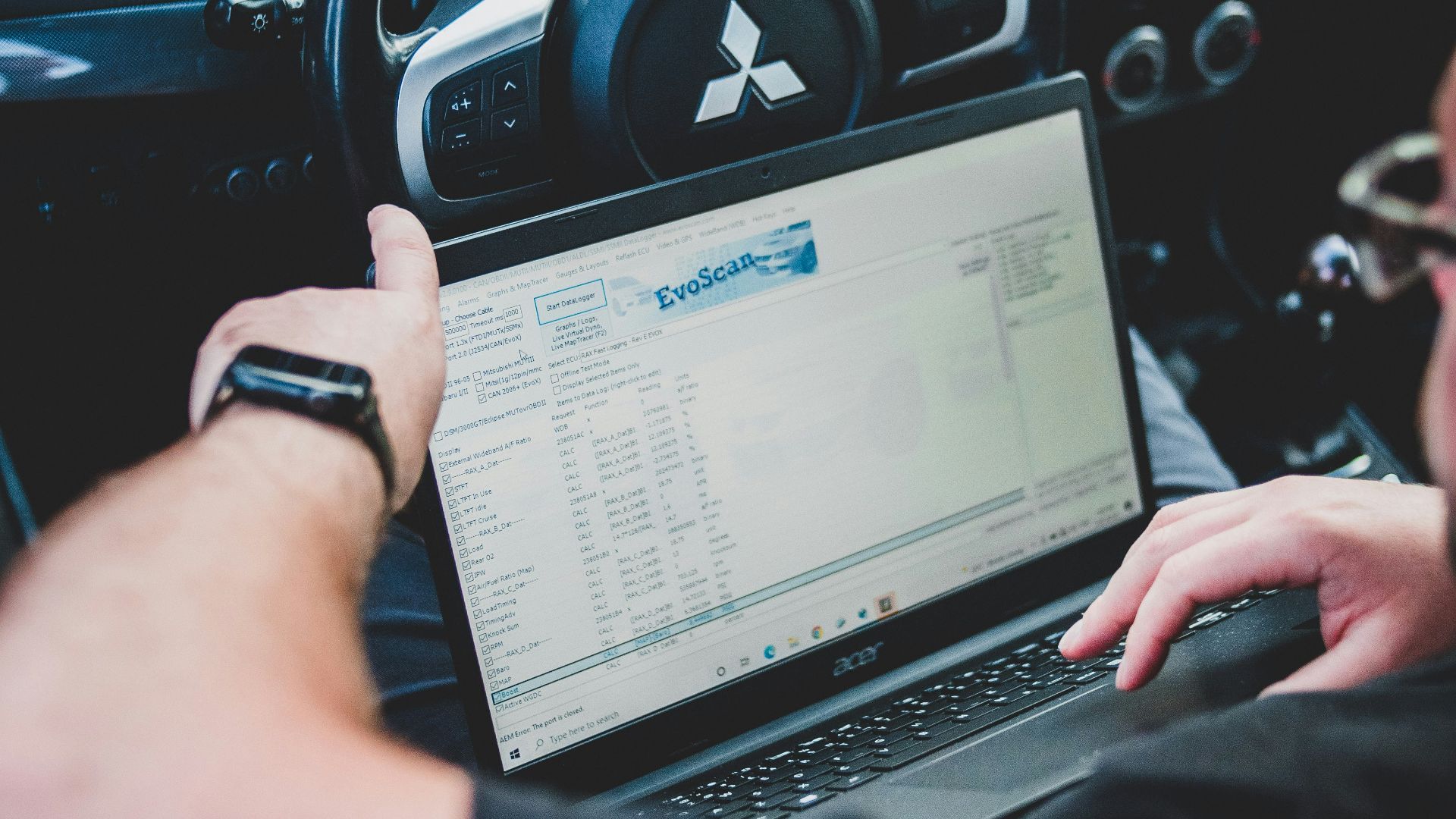 a person holding a laptop
