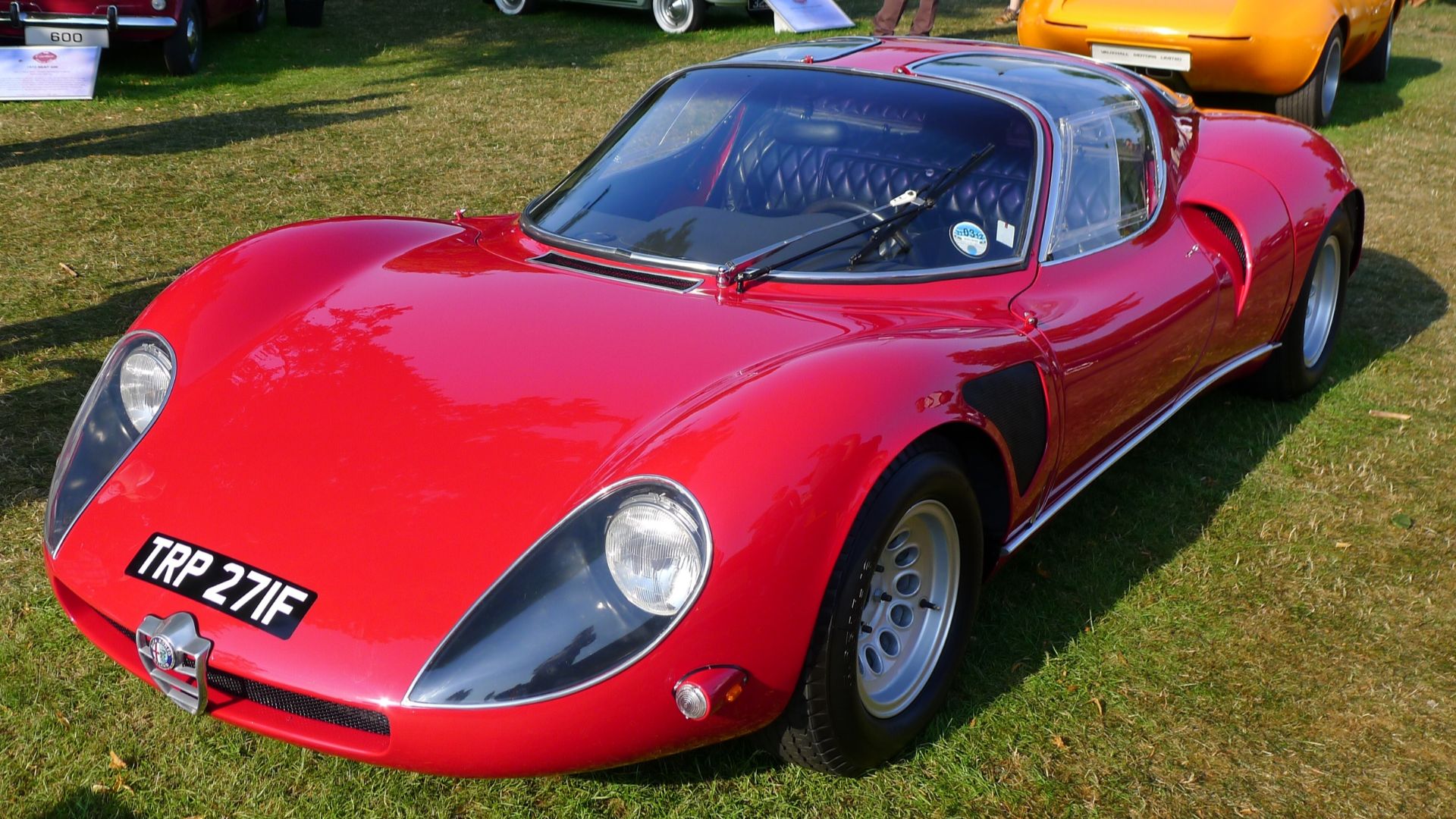 Alfa Romeo 33 Stradale, with rear of Vauxhall XVR in the background.