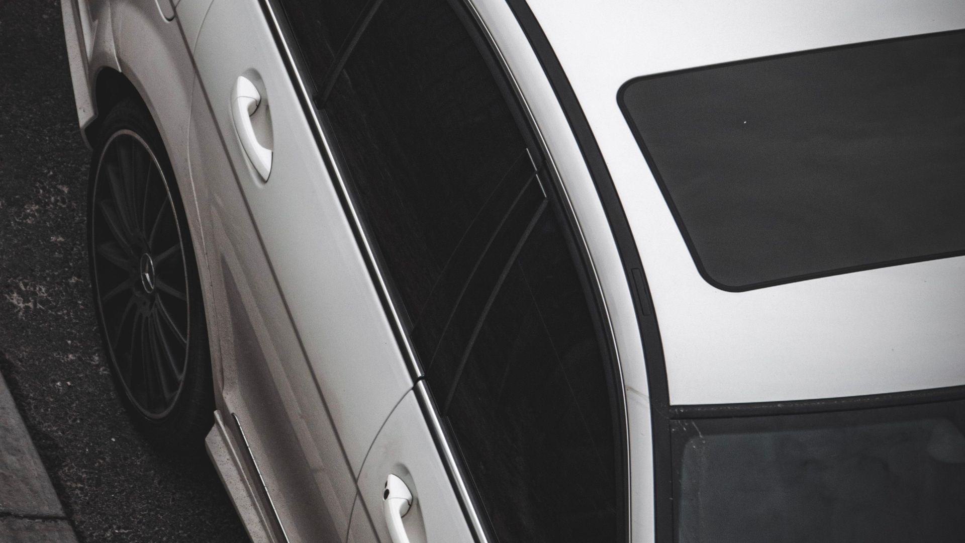 Top view of a white car with a moonroof parked in Cape Town, South Africa.