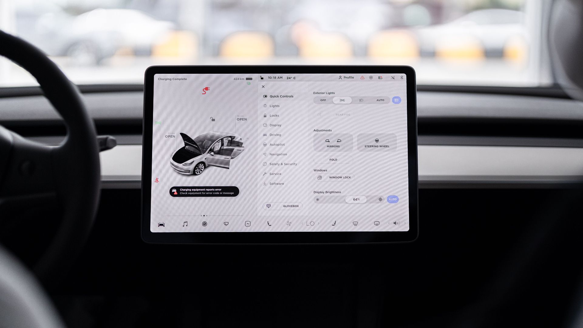 View of a modern car's dashboard featuring a digital display panel with control options.