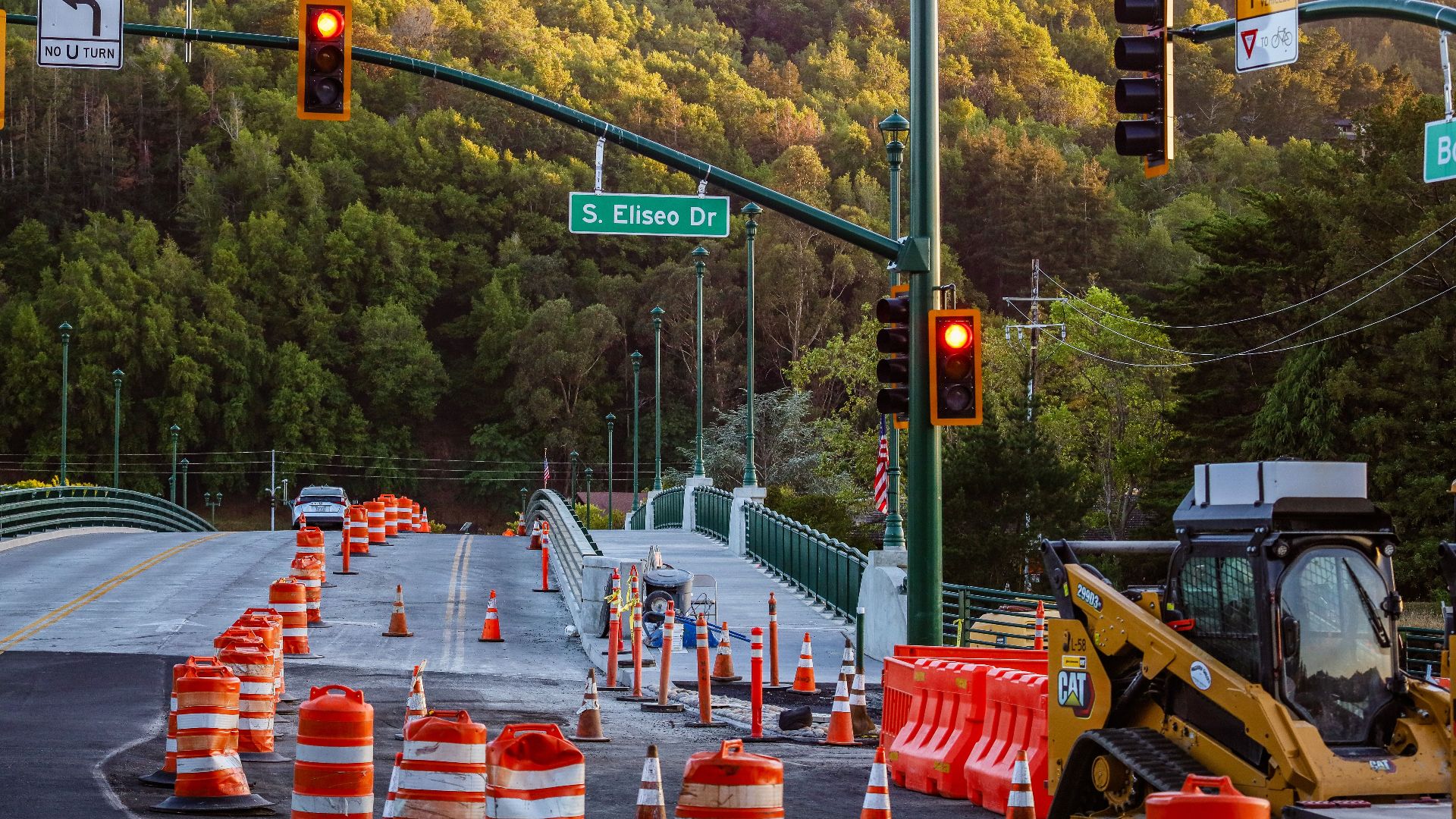 Busy road construction scene with traffic lights and signage on S. Eliseo Dr.
