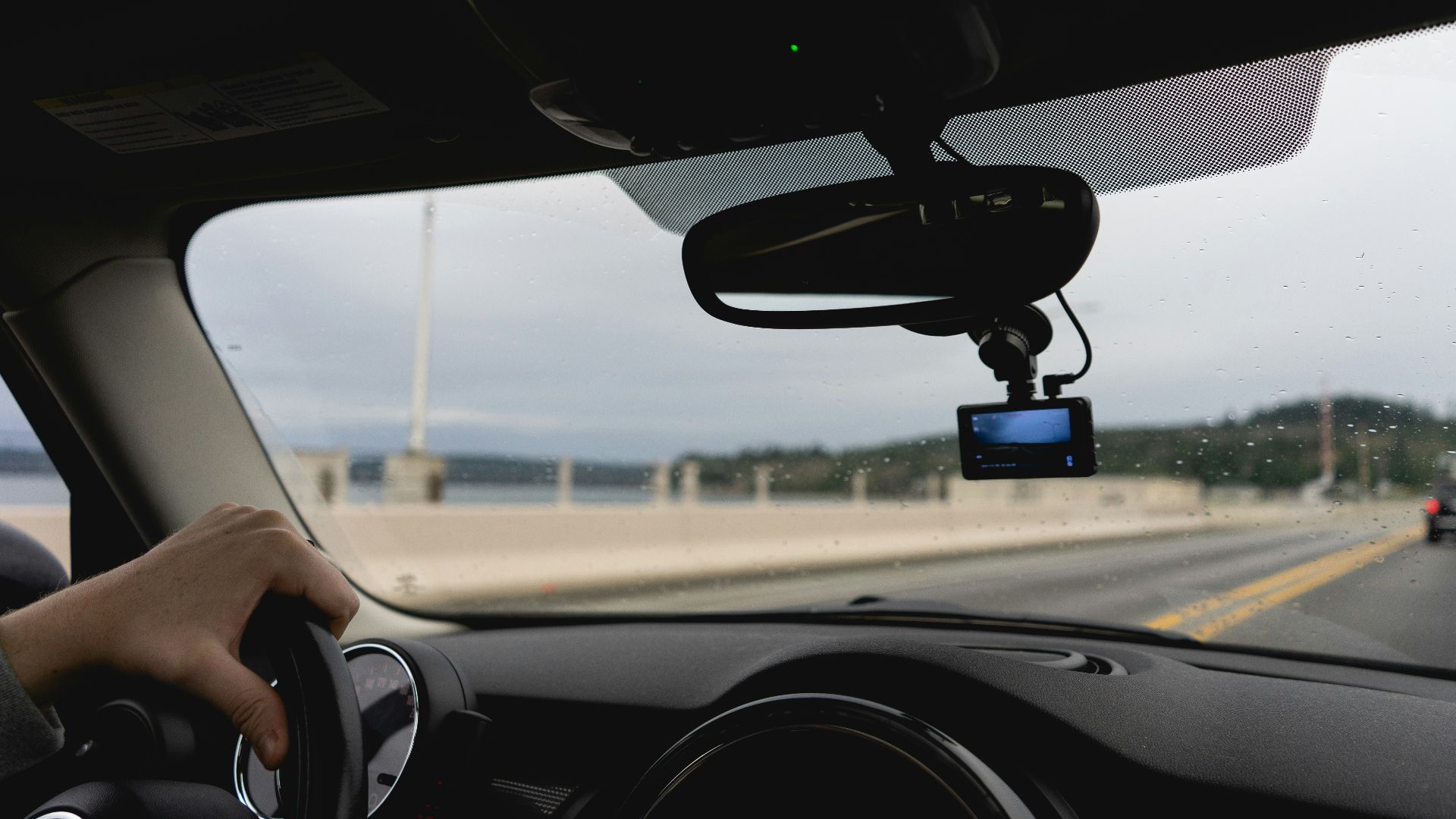 a person driving a car on a highway