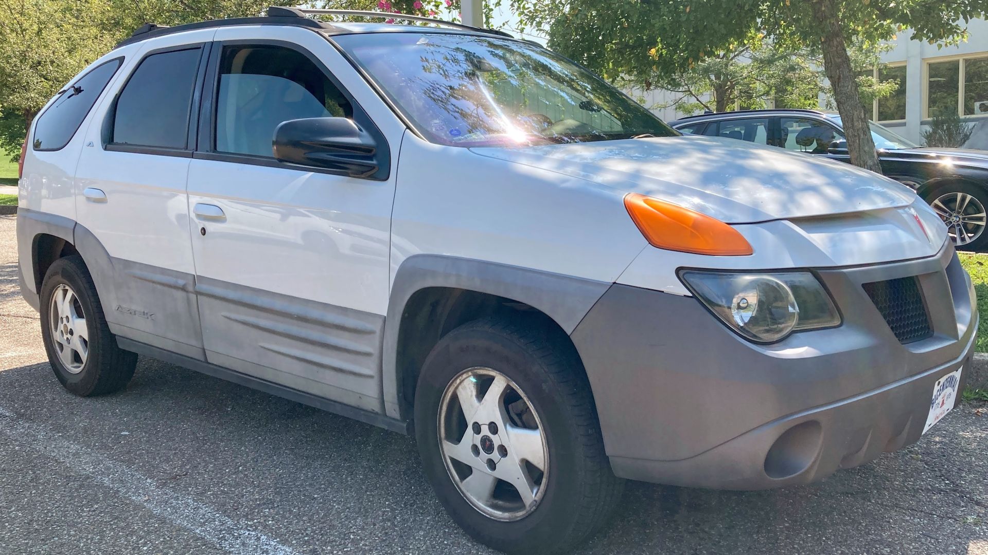 A 2001 Pontiac Aztek in Pewter Metallic, photographed in Wheeling, West Virginia. This Aztek is equipped with the 3.4L V6 engine and assembled in Ramoz Arizpe, Mexico. This is an AWD-trim Aztek. 2001 models are the rarest of all model years and have plast