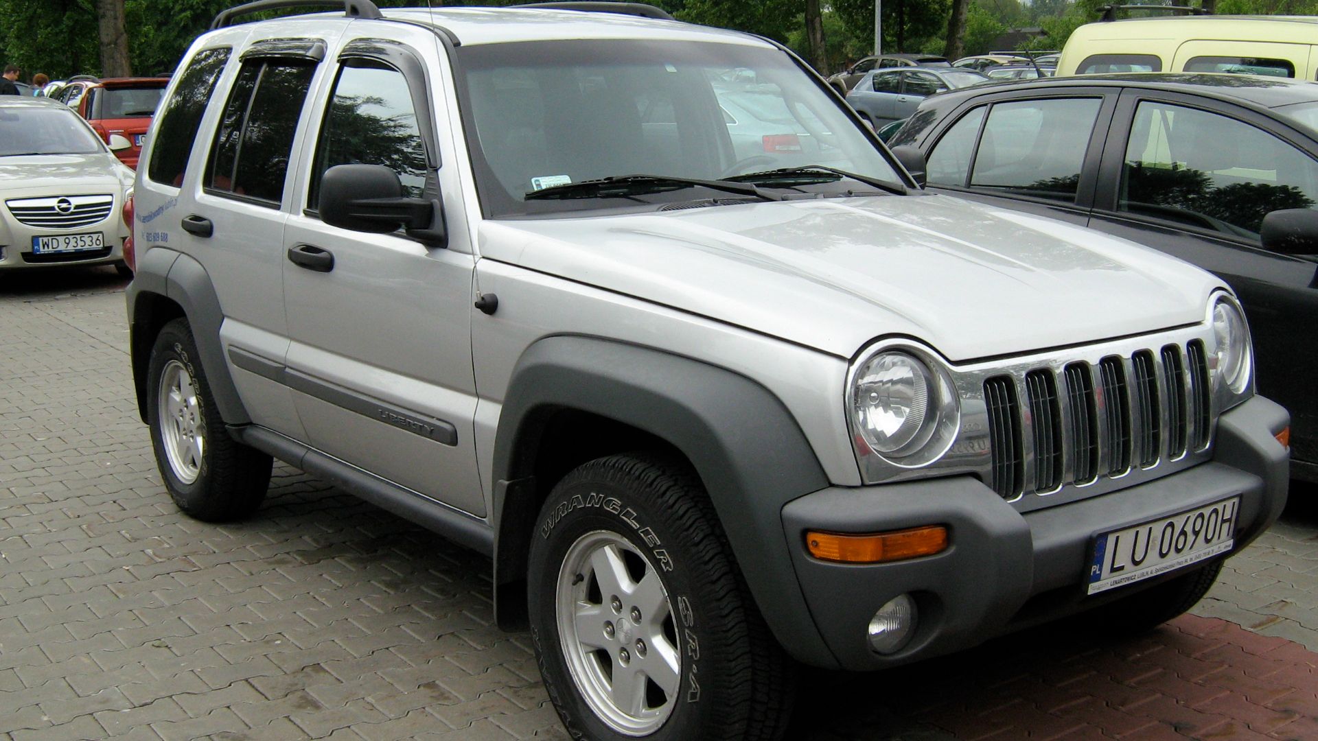 2001-2004 model year Jeep (KJ) Liberty finished in silver. Picture taken in Warsaw Poland.