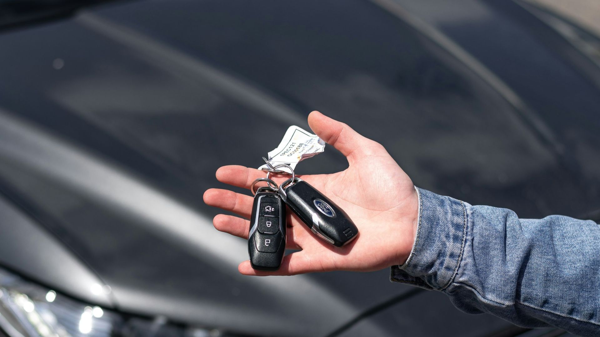 a hand holding a key