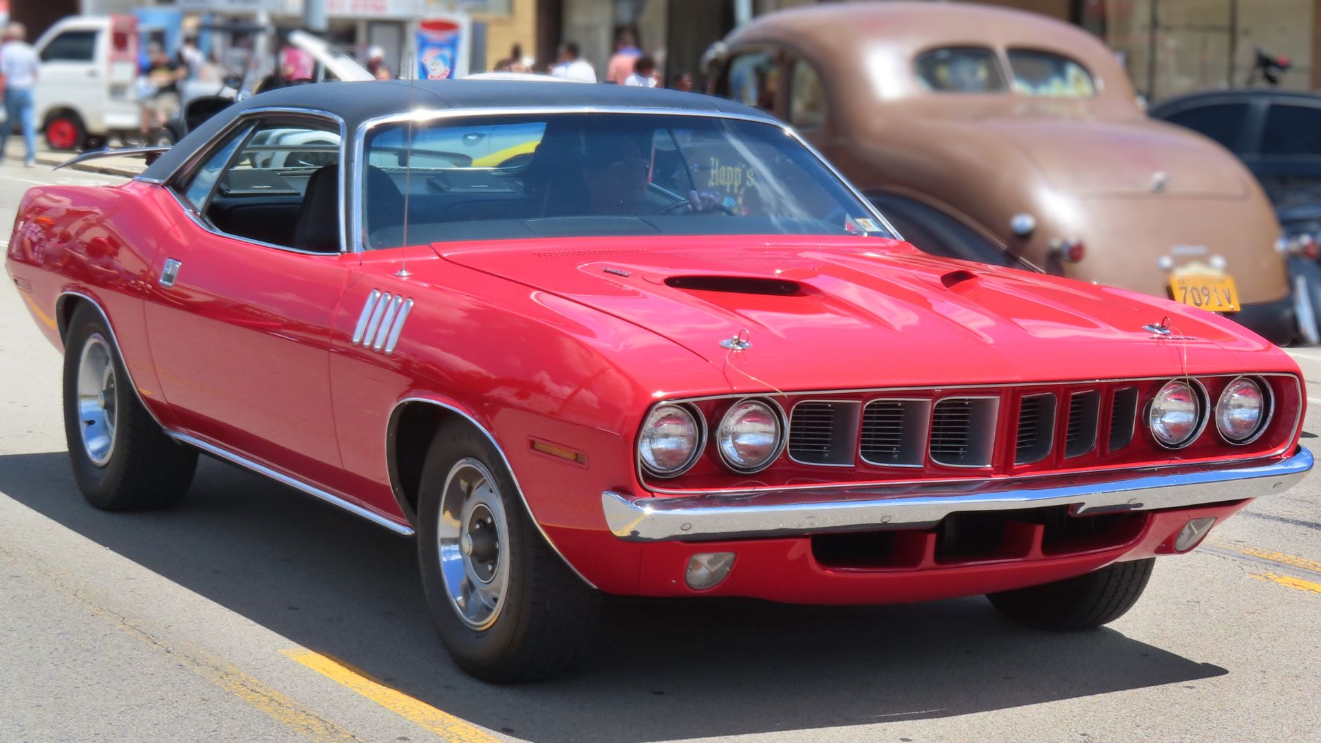 1971 Plymouth 'Cuda hardtop photographed at a car show in Beaver Falls, Pennsylvania. Finished in Rallye Red.