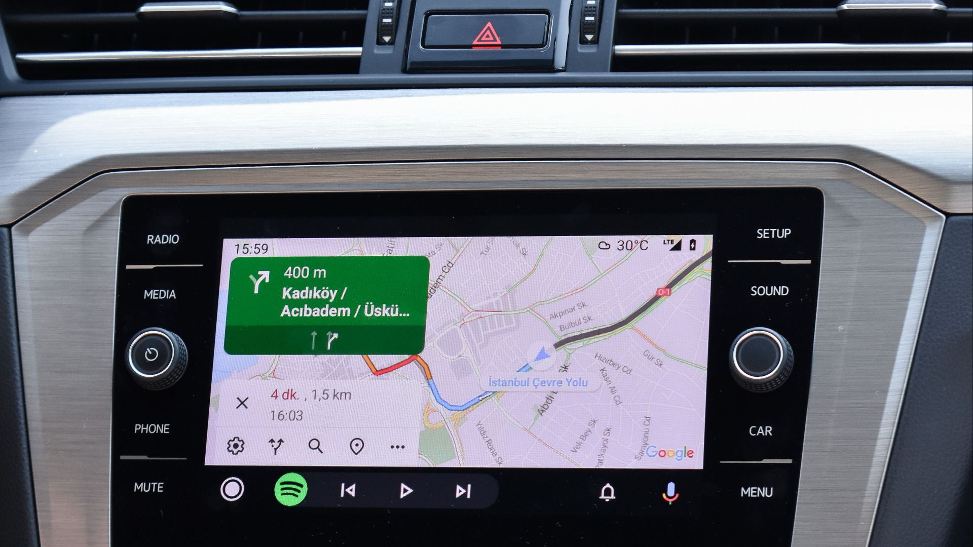 Close-up of a car GPS navigation system inside a Volkswagen Passat dashboard.