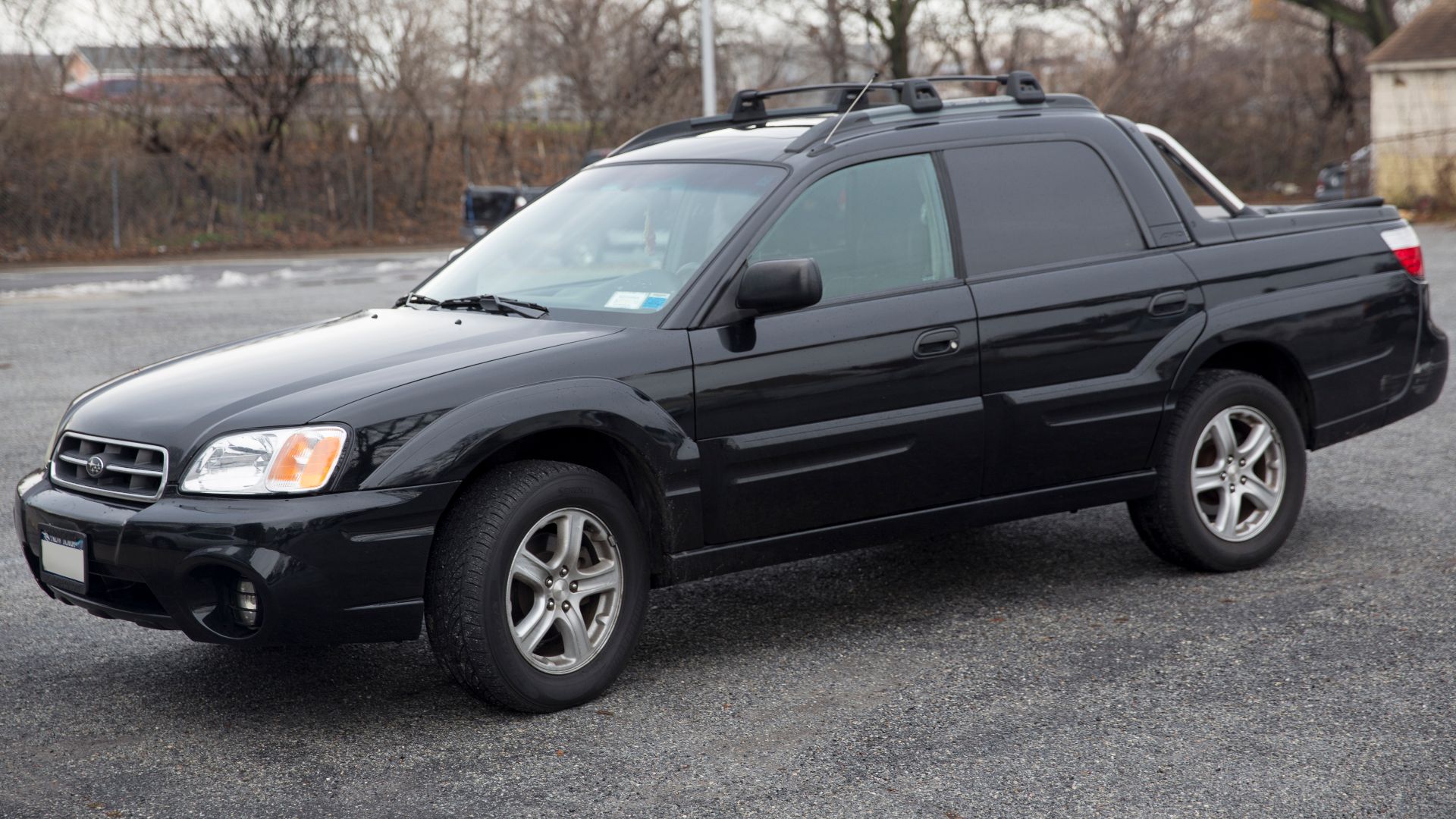 A 2006 Subaru Baja, all black.