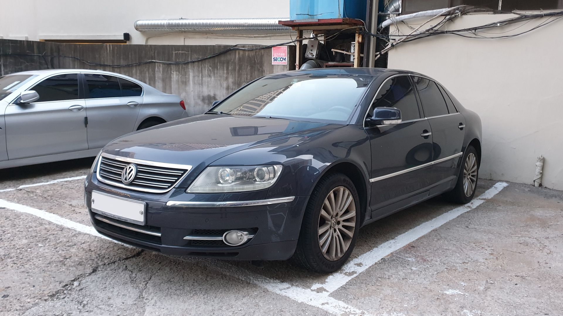 Blue Volkswagen Phaeton sedan.
