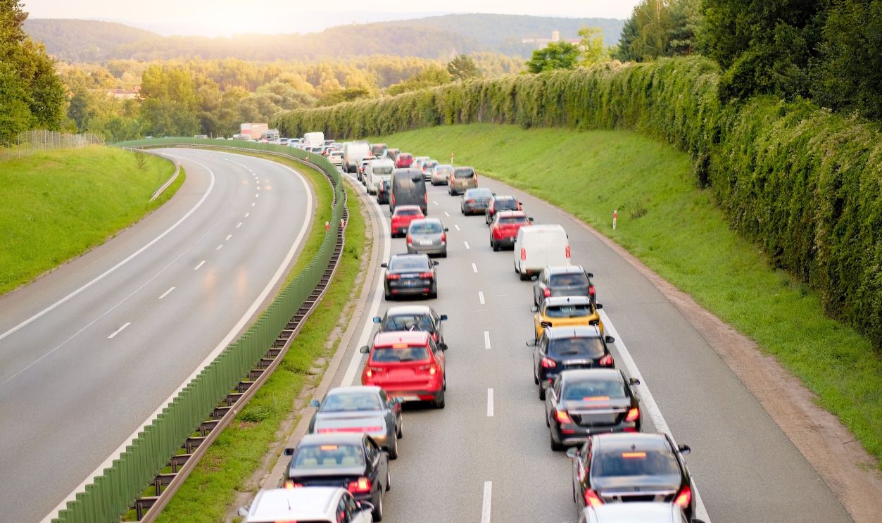 Heavy Traffic Jam Wtih Corridor Lane For Emergency Response Vehicles on European Highway During Evening Rush Hour
