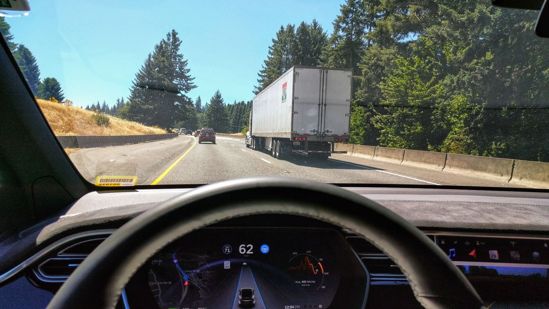 Driving in traffic with Tesla's autopilot controlling distance from the lead car and centering the vehicle in the lane.
Vehicle is a 2017 Model X 75D with dark interior.