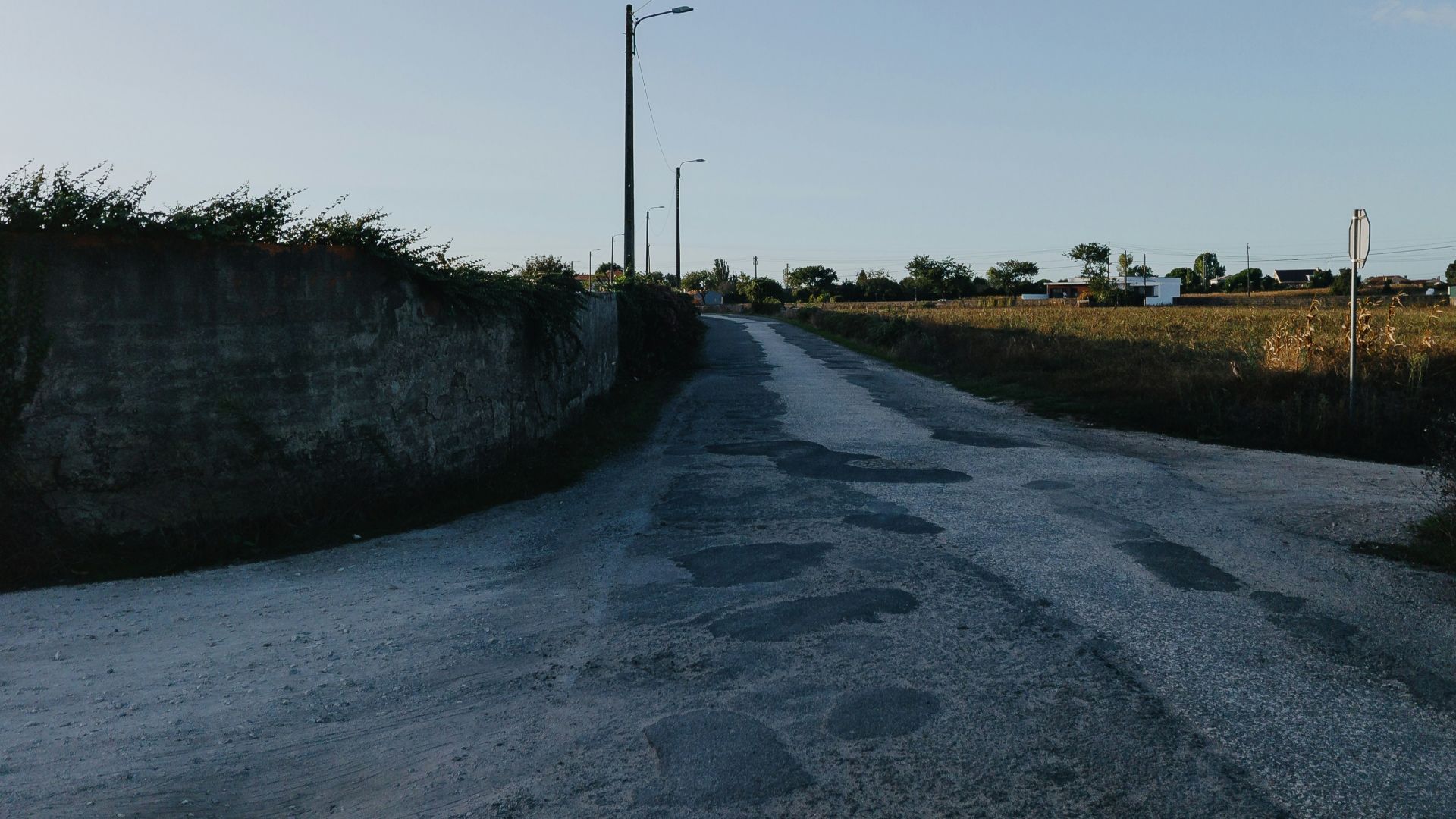 A paved road winds through a rural landscape.